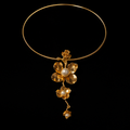 18K Gold-Plated Open Wire Collar with Floral Bloom on velvet